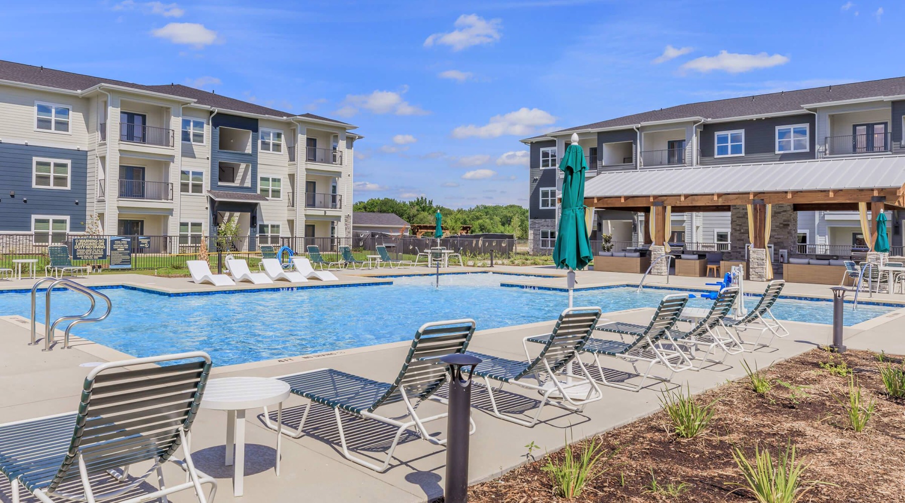 resort style pool with seating in a courtyard