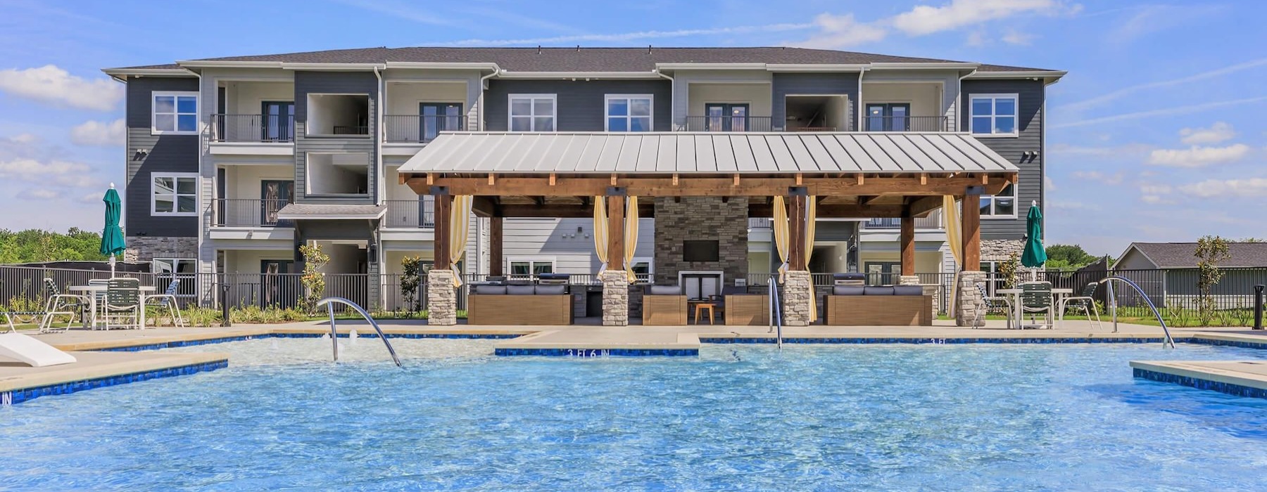 a swimming pool in front of a building