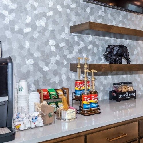 a kitchen with a coffee bar