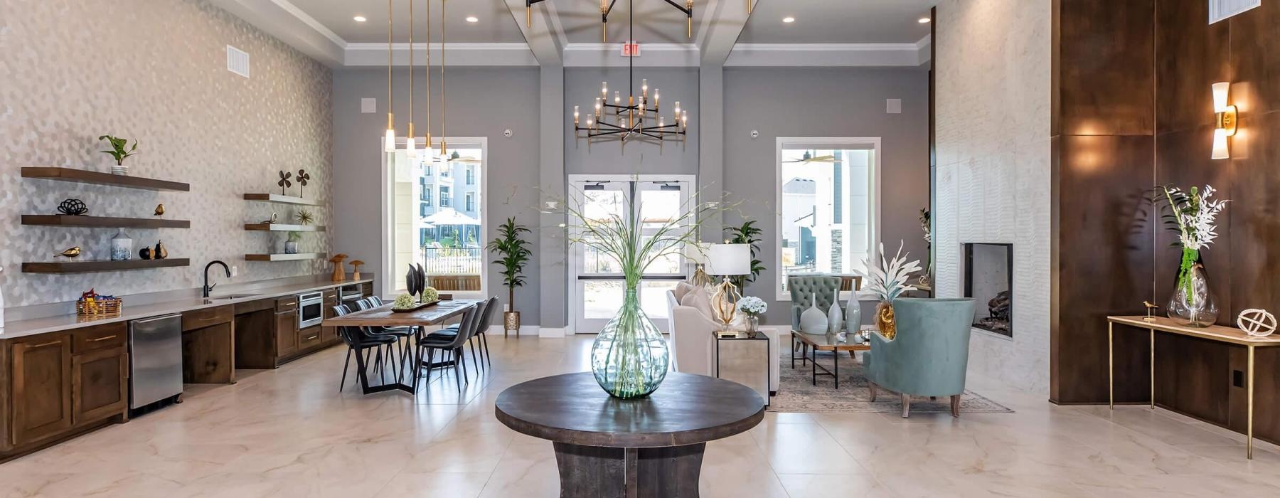 a large kitchen with a chandelier and a dining table